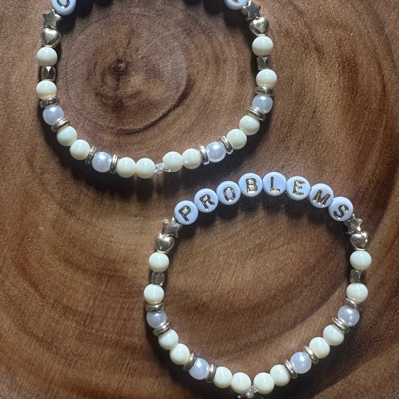 5 for $20 Taylor Swift Handmade Friendship Beaded Bracelet
“Champagne Problems” - Picture 2 of 2